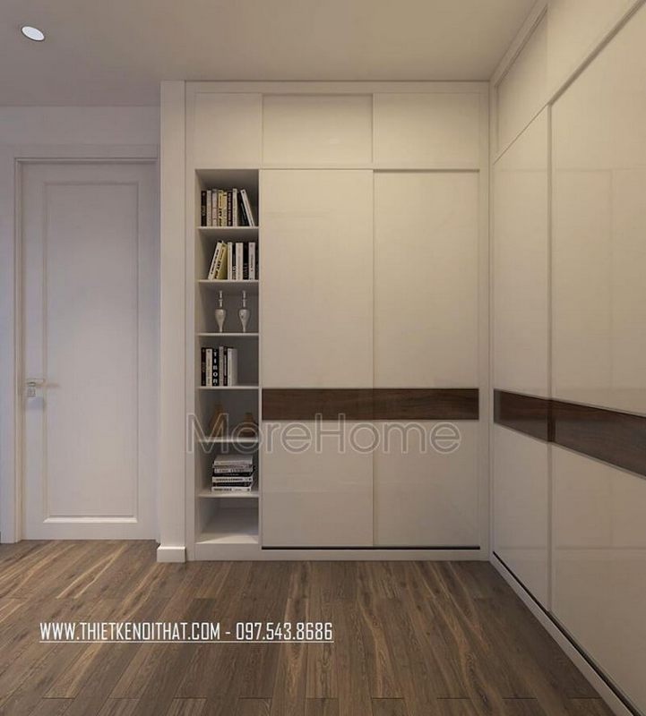 Sự hòa trộn màu sắc giữa tủ quần áo cửa trượt cao cấp màu trắng với bức tường đồng màu mang lại một ảo giác liền mạch rất thú vị.